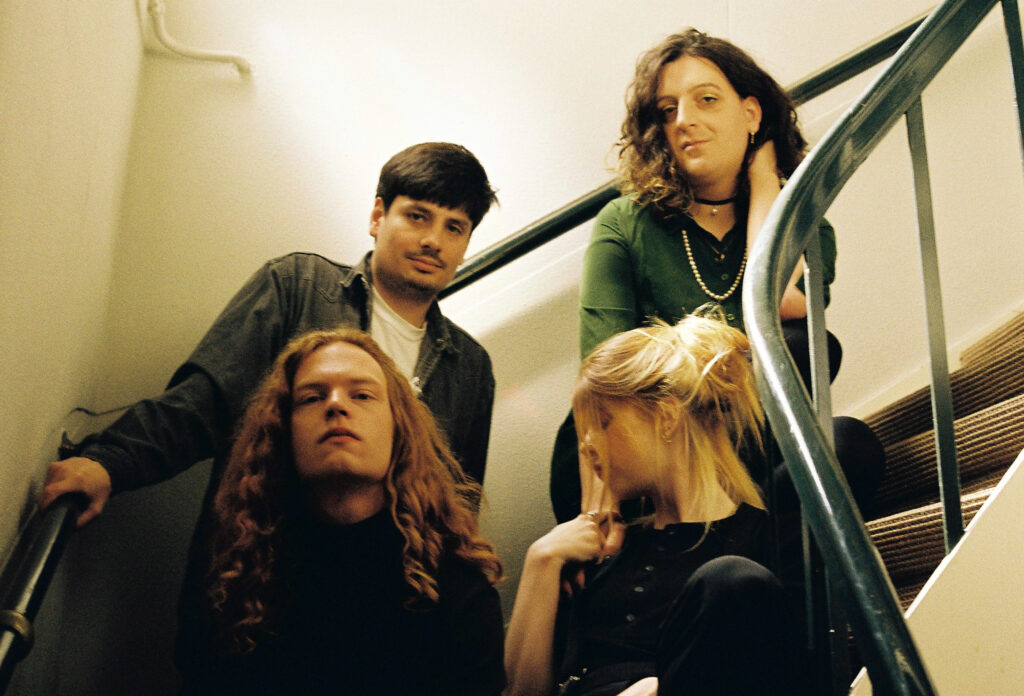 Rotterdam band Library Card sitting in staircase, press photo